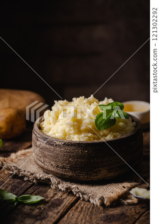 Mashed potatoes in bowl 121302292