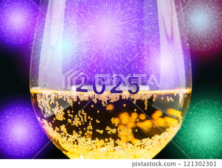 A glass of champagne elegantly displayed with 2025 written on it A glass of champagne elegantly displayed with 2025 written on it 121302301