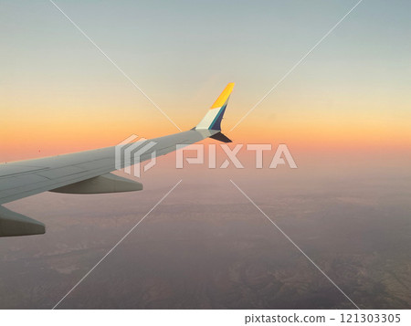 A sunset glow seen from an airplane 121303305