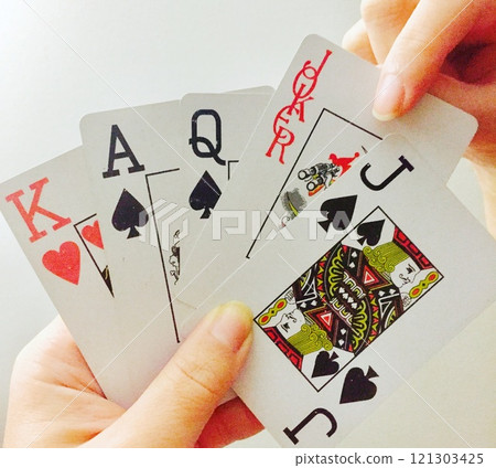 Joker in hand 121303425