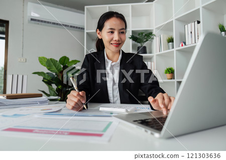 business woman entrepreneur in office using laptop at work, professional female company executive wearing suit working on computer at workplace 121303636