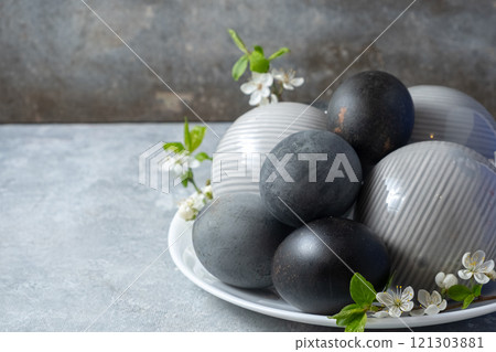 Elegant Black and gray Decorative Eggs with cherry blossom branch 121303881