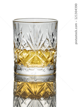 Whiskey in a glass on a white background. 121304390
