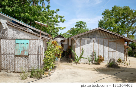 Huts in a village on a small island in the Philippines. Huts in a village on a small island in the Philippines. 121304402
