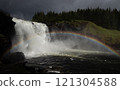 Large waterfall in Sweden with a rainbow 121304588