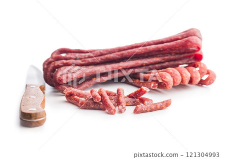 Smoked kabanos. Mini dried thin sausages isolated on white background 121304993