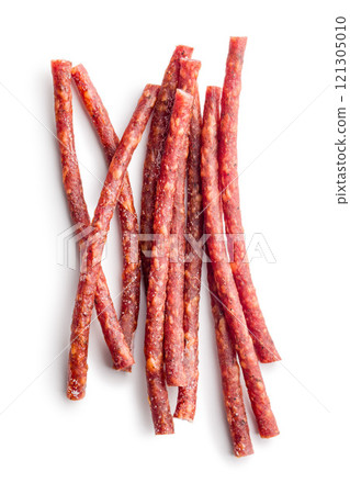 Smoked kabanos. Mini dried thin sausages isolated on white background Smoked kabanos. Mini dried thin sausages isolated on white background 121305010