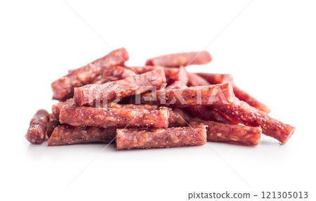 Smoked kabanos. Mini dried thin sausages isolated on white background Smoked kabanos. Mini dried thin sausages isolated on white background 121305013
