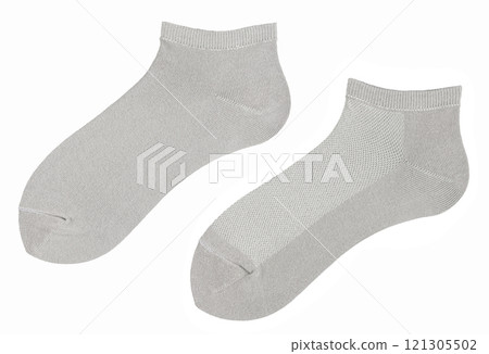 Grey long socks is isolated on a white background. Grey long socks is isolated on a white background. 121305502