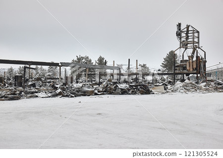 Burning shopping center remains Burning shopping center remains 121305524