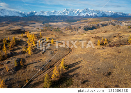 Scenic mountain landscape in Altai during vibrant autumn season with golden larch trees Scenic mountain landscape in Altai during vibrant autumn season with golden larch trees 121306288