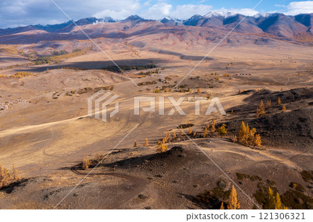 Beautiful mountain landscape in Altai with autumnal colors and distant snowy peaks 121306321