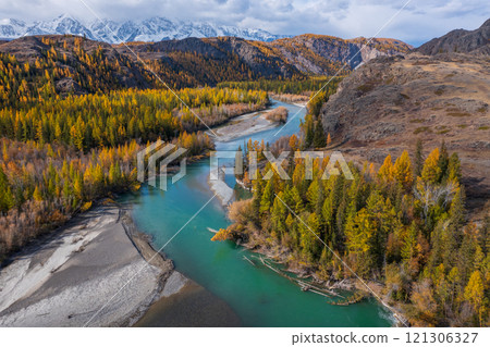 Scenic river surrounded by colorful forest during autumn in Altai mountains 121306327