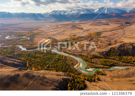 Aerial view of scenic mountainous valley in autumn with winding river 121306379