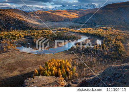 Aerial view of autumn valley with mountains and winding river 121306415