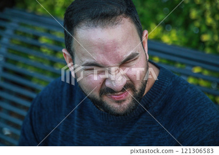 Man Shows Disgust After Lemon Bite Man Shows Disgust After Lemon Bite 121306583