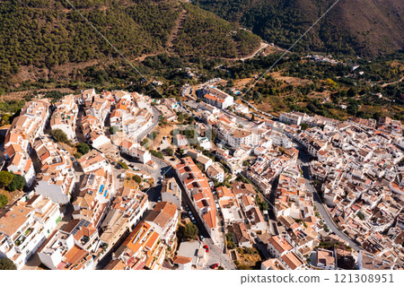 Ojen, small Spanish old town village of white Andalucian houses with green nature around on a sunny day Ojen, small Spanish old town village of white Andalucian houses with green nature around on a sunny day 121308951