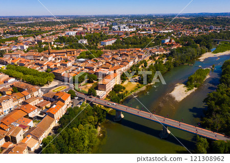 Flight over the city Muret and Garonne river on summer day 121308962