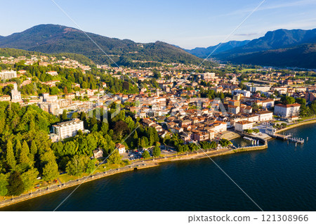 Aerial view of Luino, is small town on the shore of Lake Maggiore in province of Varese Aerial view of Luino, is small town on the shore of Lake Maggiore in province of Varese 121308966