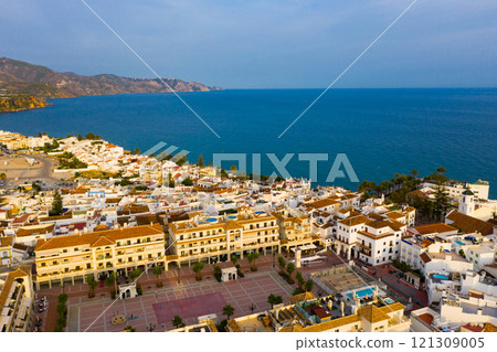 Aerial view of Spanish tourist city of Nerja on Mediterranean coast Aerial view of Spanish tourist city of Nerja on Mediterranean coast 121309005