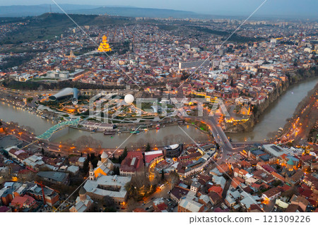 Night aerial view of Tbilisi city with Kura river Night aerial view of Tbilisi city with Kura river 121309226