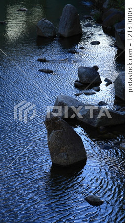 A vertical Japanese garden with many old-fashioned rocks that reflect light in the pond to create beautiful wave patterns. A vertical Japanese garden with many old-fashioned rocks that reflect light in the pond to create beautiful wave patterns. 121310003