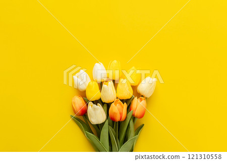 Bouquet of tulips on a yellow background Artificial flowers Spring flower background material Bouquet of tulips on a yellow background Artificial flowers Spring flower background material 121310558
