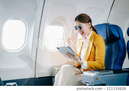 flight, inside, seat, transport, airplane, plane, business, female, passenger, technology, Asian woman, young, adult, aircraft, girl, travel, businesswoman, commercial, corporate, fly, jet, journey, 121310826