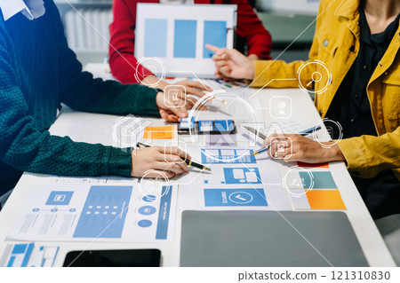 Close up view of UI developer team brainstorming on their project with laptop, smartphone and digital tablet. 121310830
