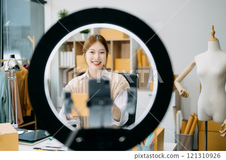 Fashion blogger concept, Young Asian women selling clothes on video streaming.Startup small business SME Fashion blogger concept, Young Asian women selling clothes on video streaming.Startup small business SME 121310926