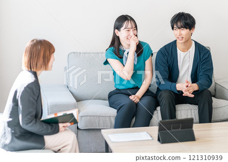 A young couple consulting about housing 121310939