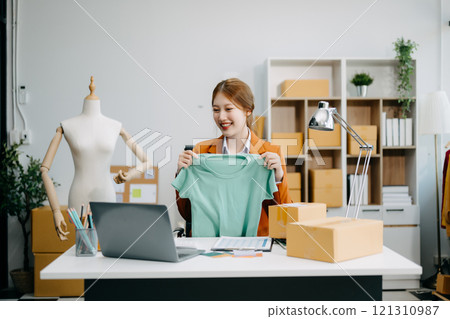 Fashion blogger concept, Young Asian women selling clothes on video streaming.Startup small business SME 121310987