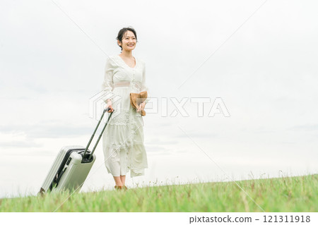 Young Asian woman traveling with a suitcase (summer, resort, vacation) Young Asian woman traveling with a suitcase (summer, resort, vacation) 121311918
