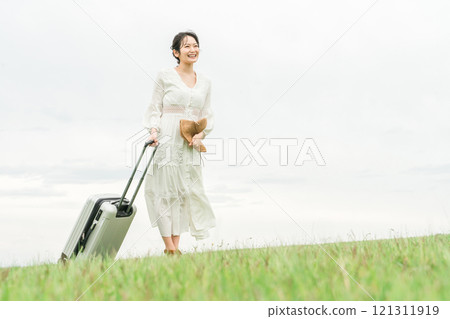 Young Asian woman traveling with a suitcase (summer, resort, vacation) Young Asian woman traveling with a suitcase (summer, resort, vacation) 121311919