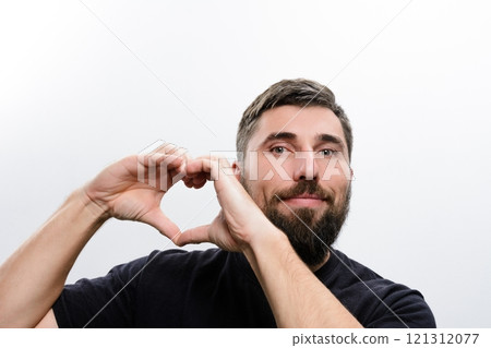 Man making heart shape with hands Man making heart shape with hands 121312077