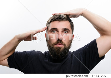 Man with beard saluting and adjusting hair Man with beard saluting and adjusting hair 121312079