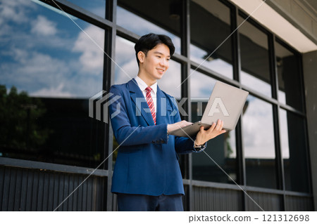 Successful Businessman in suit using tablet outdoors. Perfect for corporate, technology, and professional themes Successful Businessman in suit using tablet outdoors. Perfect for corporate, technology, and professional themes 121312698