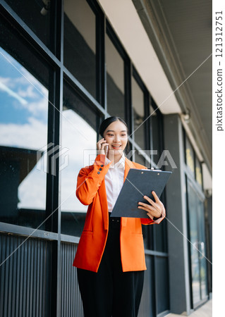 Young Asian business woman leader entrepreneur, professional manager holding digital tablet computer 121312751