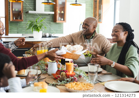 African american parents, children and grandparents celebrating at thanksgiving dinner 121314273