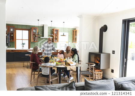African american parents, children and grandparents celebrating at thanksgiving dinner African american parents, children and grandparents celebrating at thanksgiving dinner 121314341