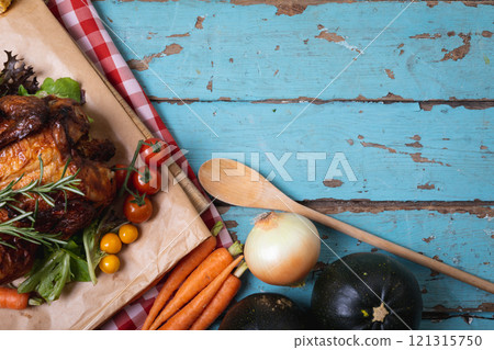 Cooked chicken and multiple food ingredients with copy space on blue wooden surface Cooked chicken and multiple food ingredients with copy space on blue wooden surface 121315750