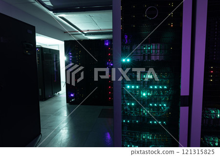 Data center with multiple rows of fully operational server racks Data center with multiple rows of fully operational server racks 121315825