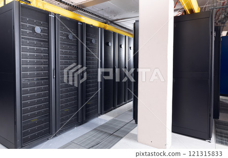 Data center with multiple rows of fully operational server racks 121315833