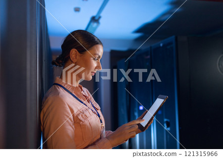 Caucasian female engineer using digital tablet in computer server room Caucasian female engineer using digital tablet in computer server room 121315966