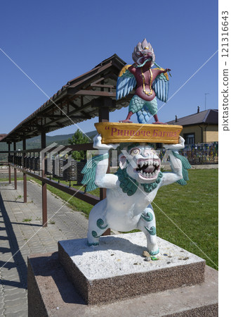 A statue of a Buddhist deity next to prayer drums at Rinpoche Bagsha datsan. Inscription: 'Rinpoche Bagsha' 121316643