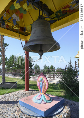 A Buddhist canopy with a bell and piecies of cloth with prayers (himmorin) at Rinpoche Bagsha datsan A Buddhist canopy with a bell and piecies of cloth with prayers (himmorin) at Rinpoche Bagsha datsan 121316647