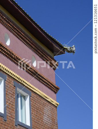 A fragment of a Buddhist building with a dragon's head in Rinpoche Bagsha datsan A fragment of a Buddhist building with a dragon's head in Rinpoche Bagsha datsan 121316651