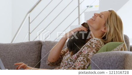 Woman playing with cat at home 4k 121316728