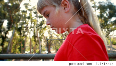 Girl walking on obstacle in boot camp Girl walking on obstacle in boot camp 121316842