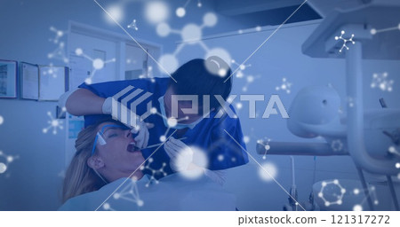 Image of molecules over diverse female dentist and patient 121317272